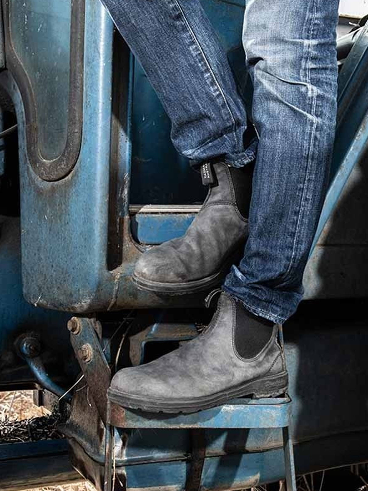 Blundstone 587 rustic black Chelsea boots worn on farm machinery