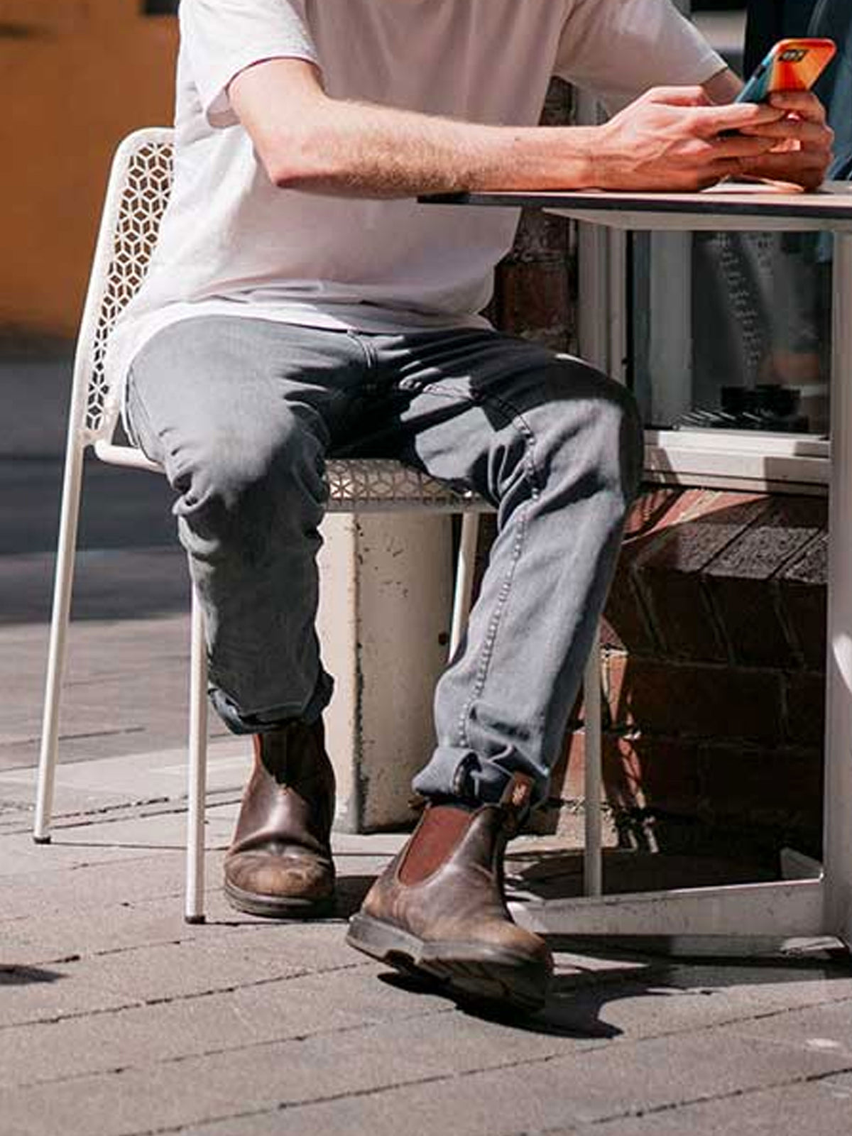 Blundstone 550 walnut brown Chelsea boots worn with grey trousers