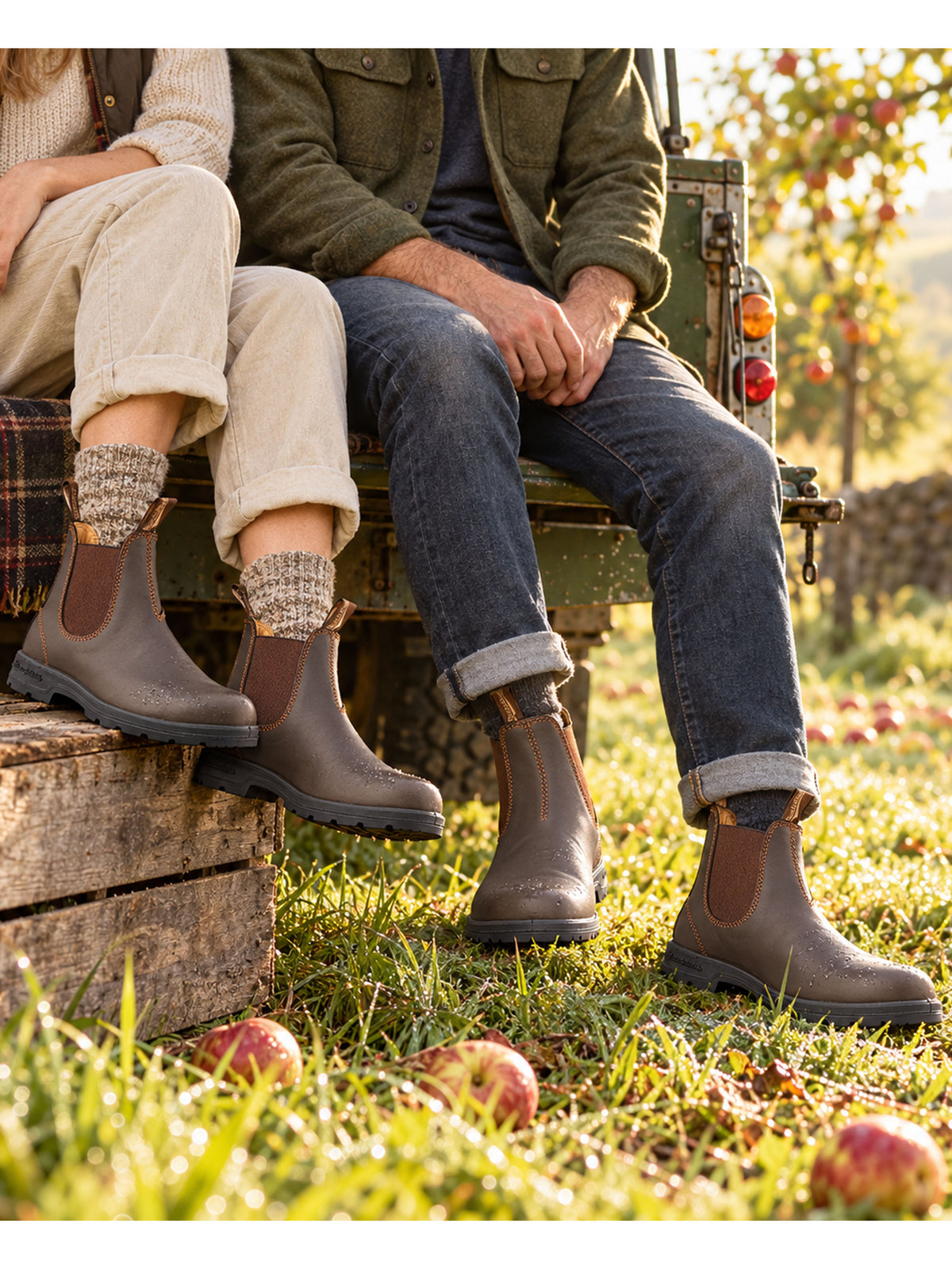 Blundstone 550 walnut brown leather Chelsea boots worn on an orchard bench