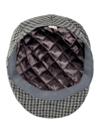 Dents Blashford men's charcoal dogtooth tweed flat cap, underside showing quilted satin lining
