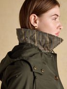 Joules Rainmore ladies green raincoat, side view of collar with heritage check lining