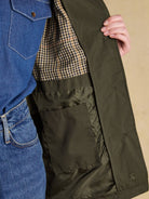 Joules Rainmore womens green waterproof raincoat, open front showing check lining and inside pocket