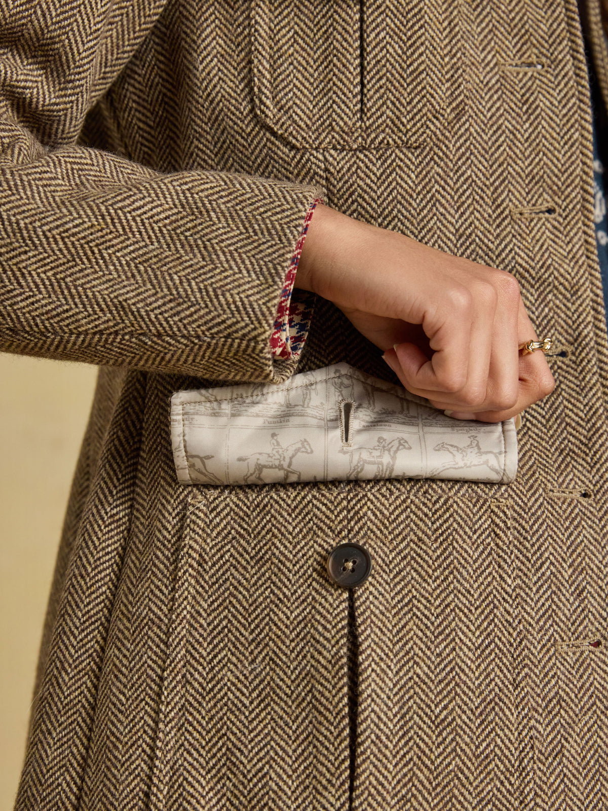 Joules Saddlebury women's brown herringbone tweed jacket, hip pocket and hem close-up