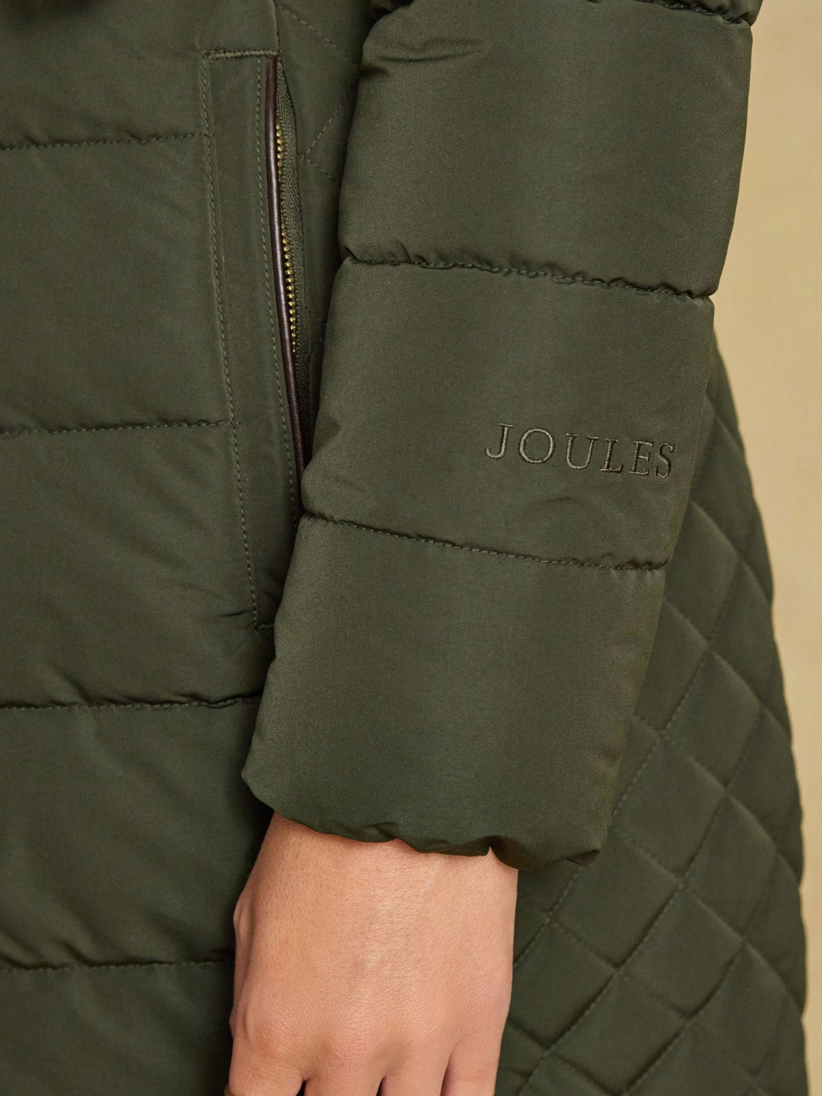 Joules Aspen long ladies showerproof padded coat in green with faux fur hood, view 7