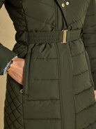 Joules Aspen long ladies showerproof padded coat in green with faux fur hood, view 6
